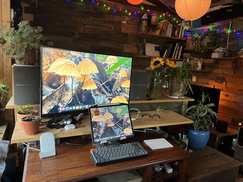 M1 iPad Pro in a stand being used with an external display, Keychron K2 keyboard and Apple's Magic Trackpad.