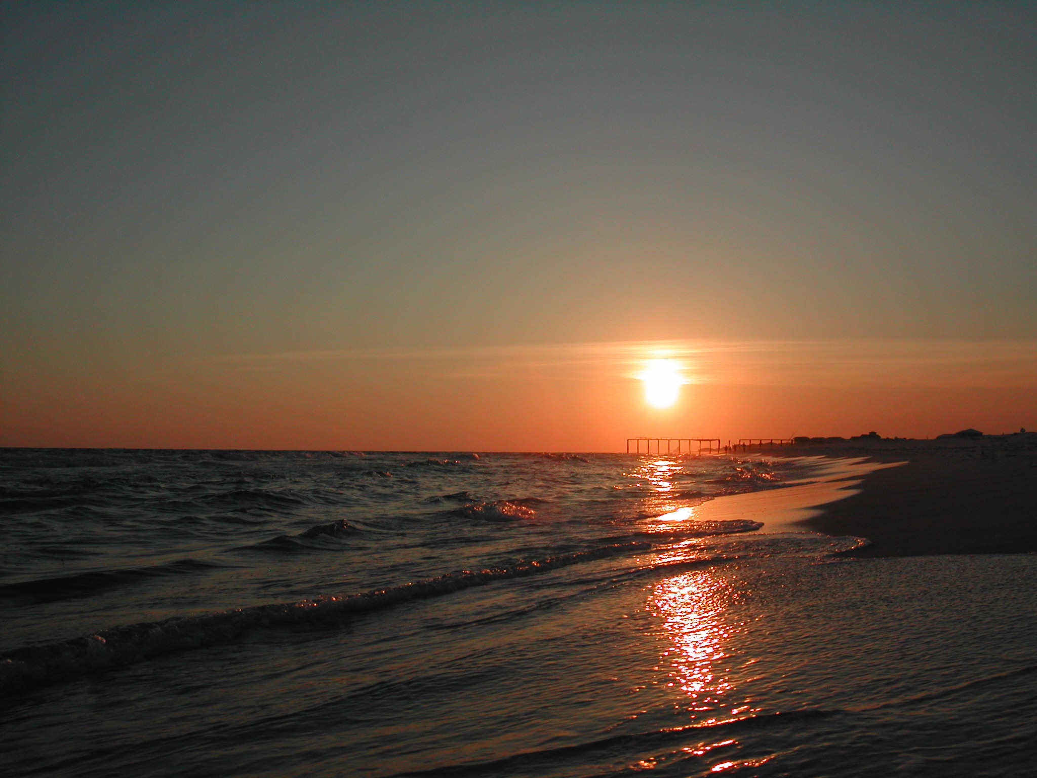 Sunset over the beach and pier