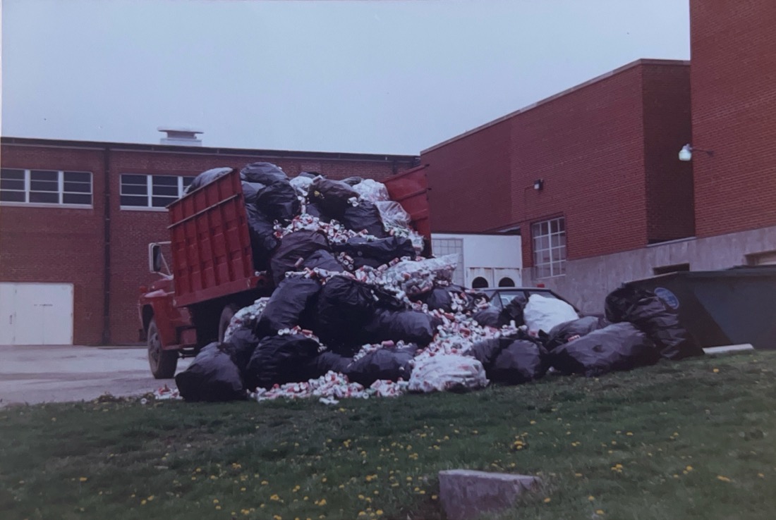 A dump truck overflowing with aluminum cans used to demonstrate what was picked up by volunteers in a weekend