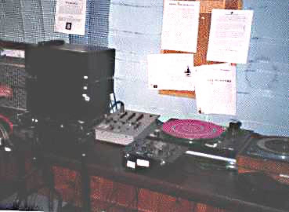 a table with turntable and other electronic elements of our radio station