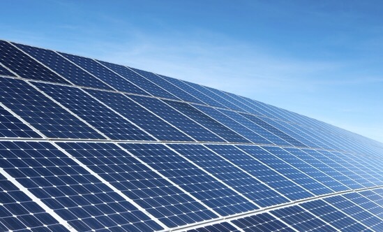 Solar panels set against a blue sky